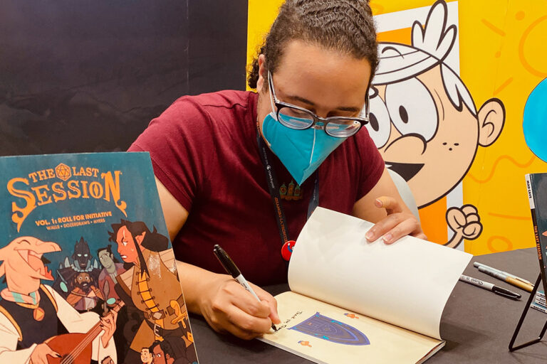 Jasmine Walls signing a copy of The Last Session