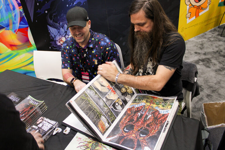 Chas! Pangburn and Kelly Williams showcasing original artwork from Skeeters at New York Comic Con