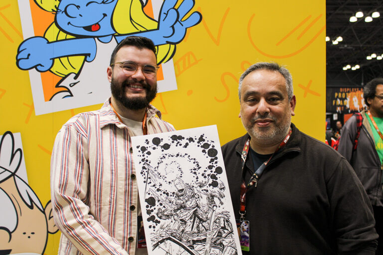 Matt Emmons with a piece of original artwork from his latest series, Crusader